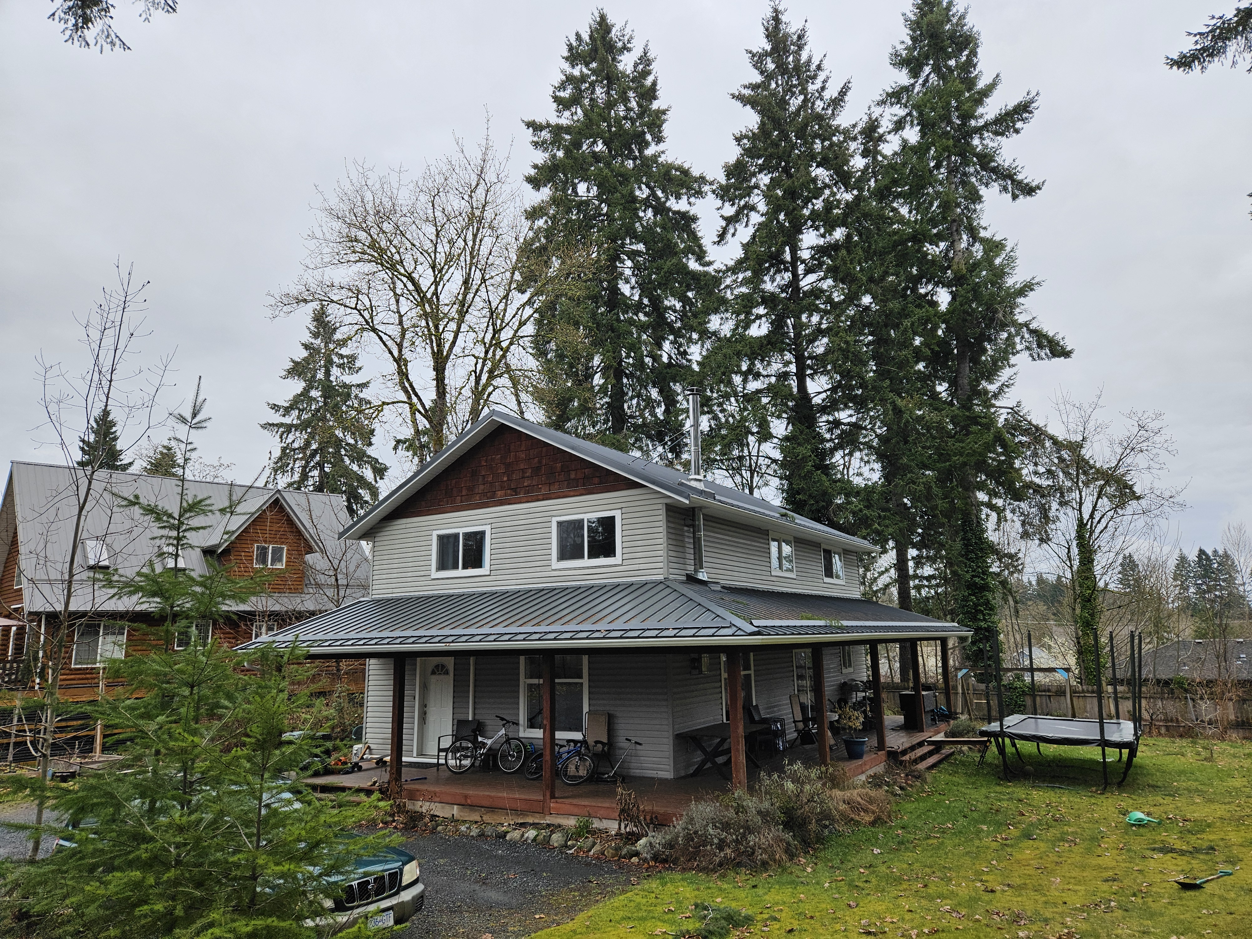 Finished roof on a Puntledge home surrounded by trees